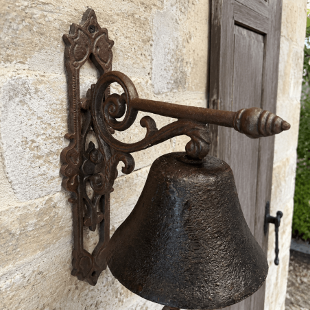 Detail of the scrollwork bracket of the rustic doorbell