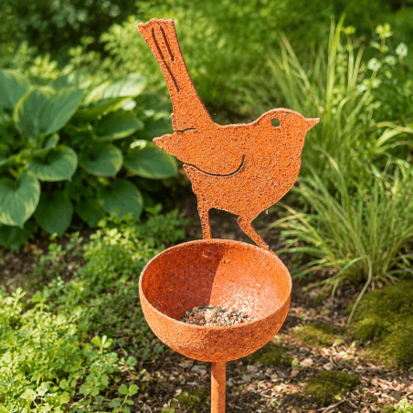 Decorative bird feeder with metal bird and seed bowl