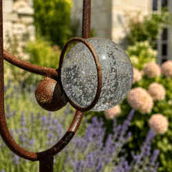 Bubbled glass counterweight on crow garden mobile