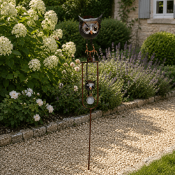 Balancing owl garden mobile on metal stake