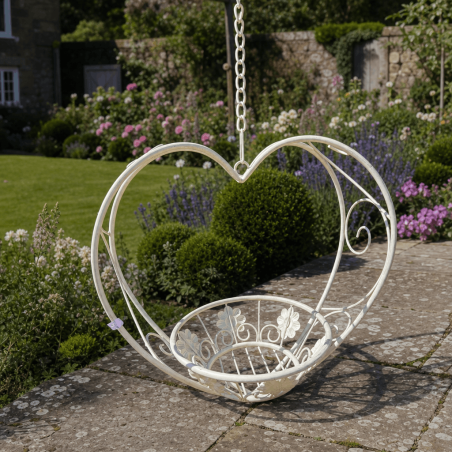 Heart-shaped hanging metal planter with basket in aged white