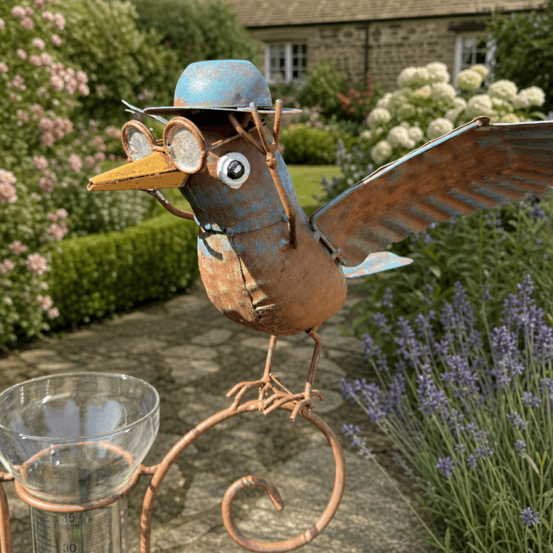 Metal crow with outstretched wings on a garden rain gauge
