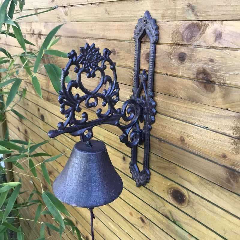 Cast-iron garden door/gate bell with a heart and arabesque design