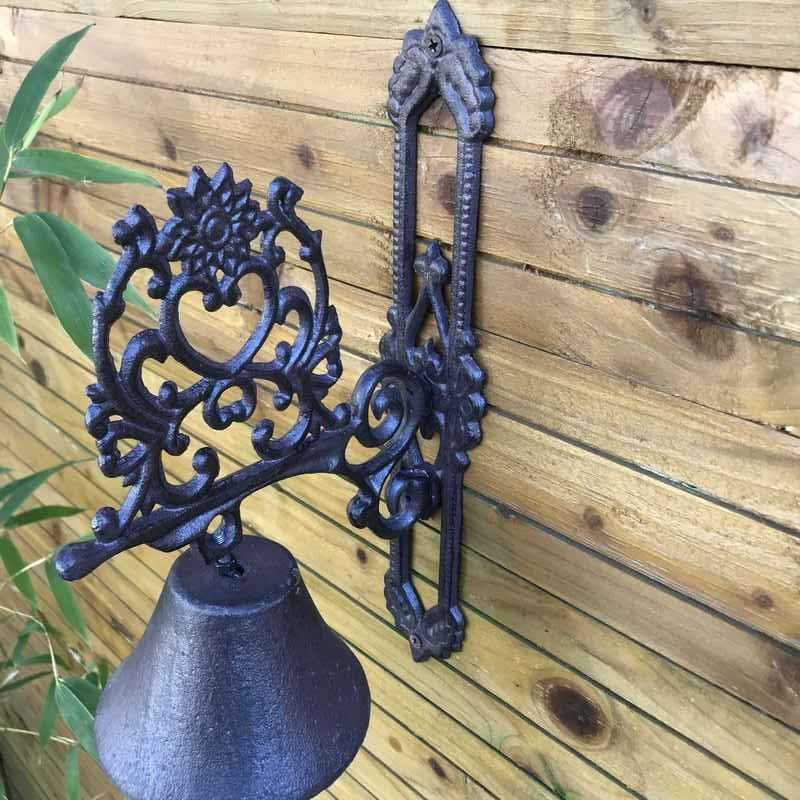 Cast-iron garden door/gate bell with a heart and arabesque design