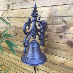 Side view of cast iron garden gate doorbell with arabesque and fleur-de-lys design