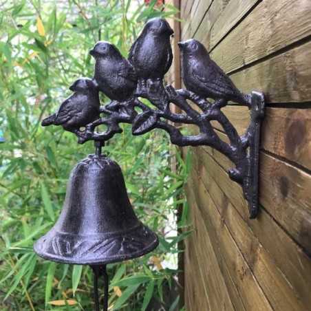 Cast-iron wind chime with birds depicted in a scene