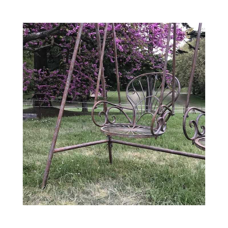 Wrought iron garden swing with comfortable seating view
