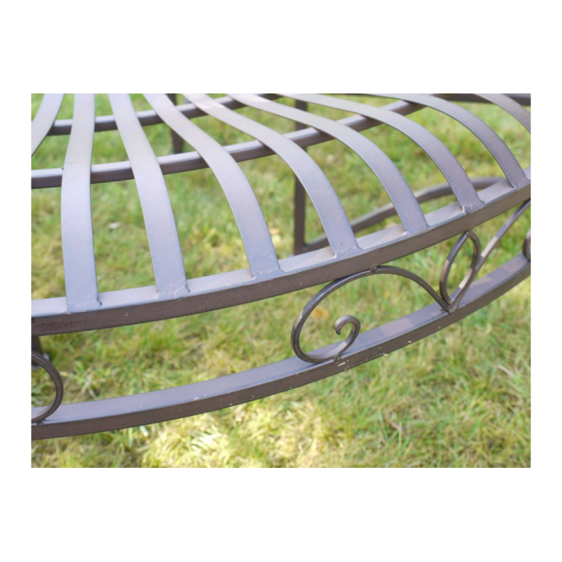 Patinated brown iron tree bench, side view