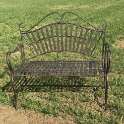 Arabesque wrought-iron garden bench staged in a setting