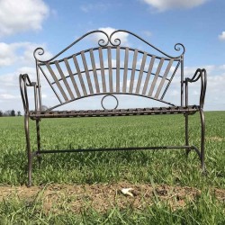 Wrought-iron garden bench with arabesque design, front view