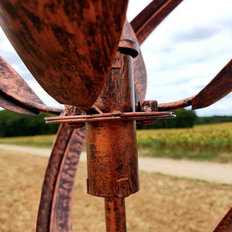 view of the axis and bearing of the copper decorative garden wind spinner