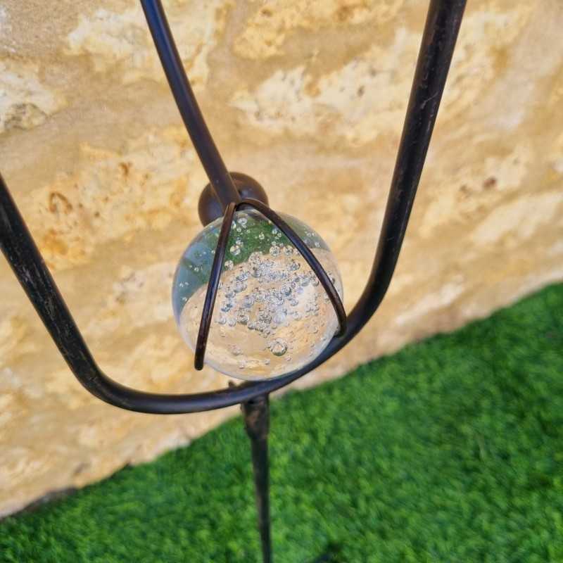 Garden mobile in iron with crow and woodpecker motif and balanced stake, featuring a bubbled glass counterweight view