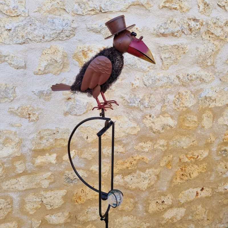 Garden mobile in iron with crow and woodpecker motif and balanced stake, side view
