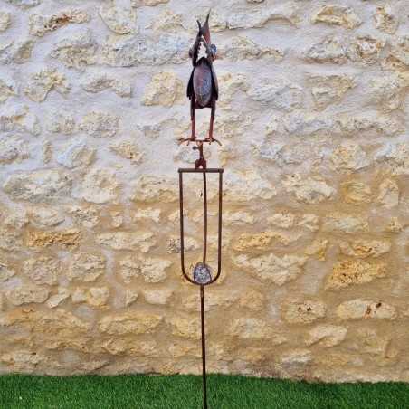 Decorative garden iron balance with colorful owl motif, side view