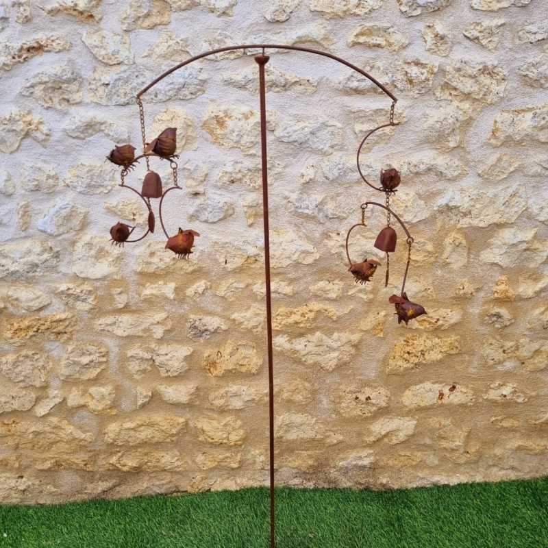 Decorative garden stake, cast iron bird bell, full view of the iron bird wind spinner