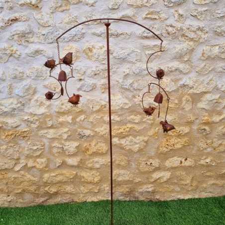 Decorative garden stake, cast iron bird bell, full view of the iron bird wind spinner
