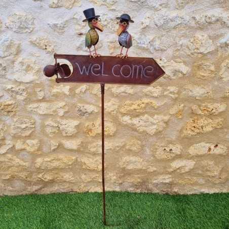Decorative metal garden mobile featuring a Welcome sign and charming birds with hats.