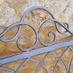 Comfortable antique gray weathered wrought-iron and wood garden bench