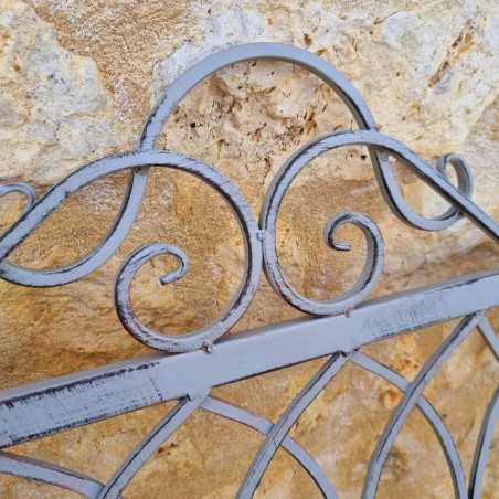 Comfortable antique gray weathered wrought-iron and wood garden bench