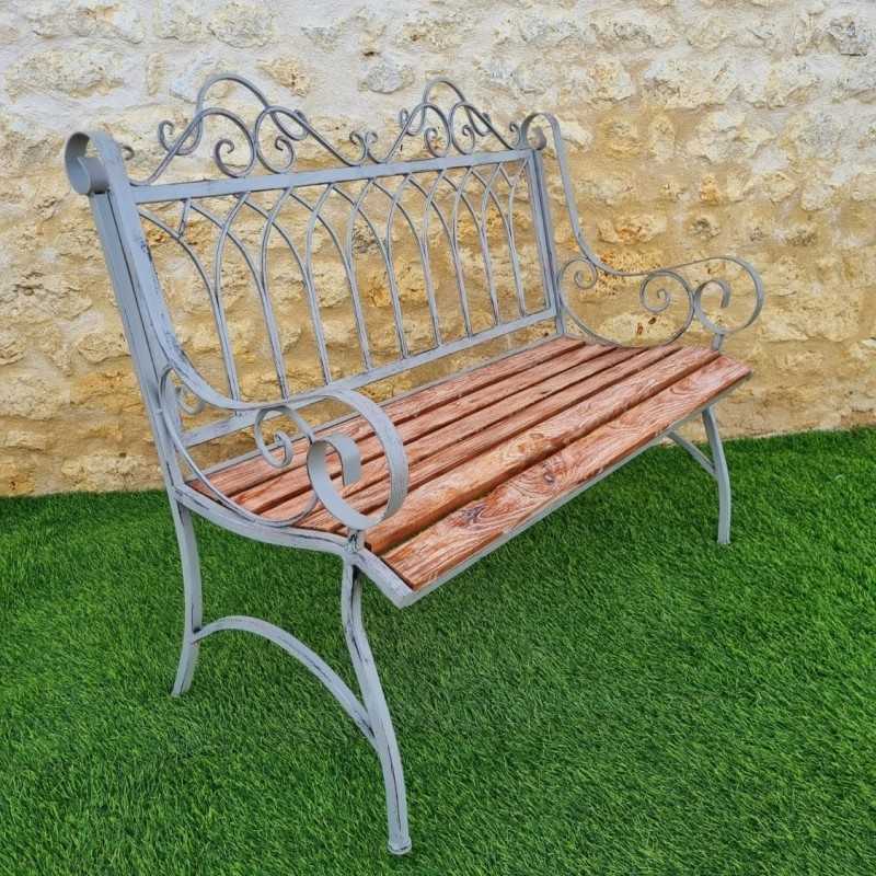Comfortable antique gray weathered wrought-iron and wood garden bench