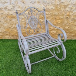 Rocking chair, iron and cast-iron armchair with an aged gray patina, outdoor, full view