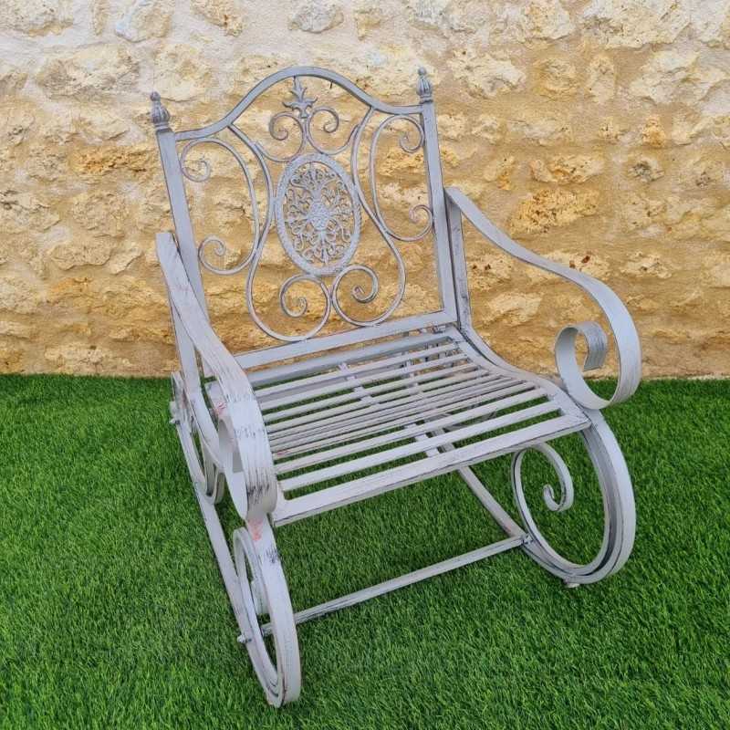 Rocking chair, iron and cast-iron armchair with an aged gray patina, outdoor, full view