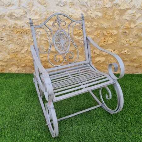 Rocking chair, iron and cast-iron armchair with an aged gray patina, outdoor, full view
