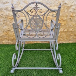 Rocking chair, iron and cast iron armchair with an aged gray patina, for outdoor use, rear view