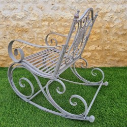 Rocking chair, outdoor iron and cast iron rocking armchair with an aged gray patina