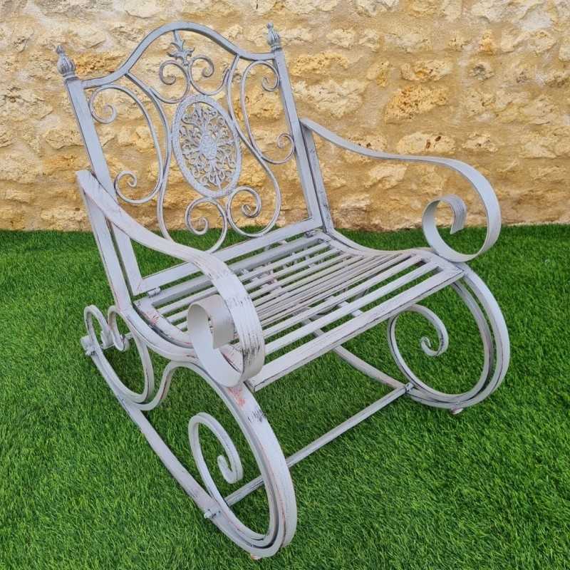 Rocking chair, outdoor iron and cast iron rocking armchair with an aged gray patina