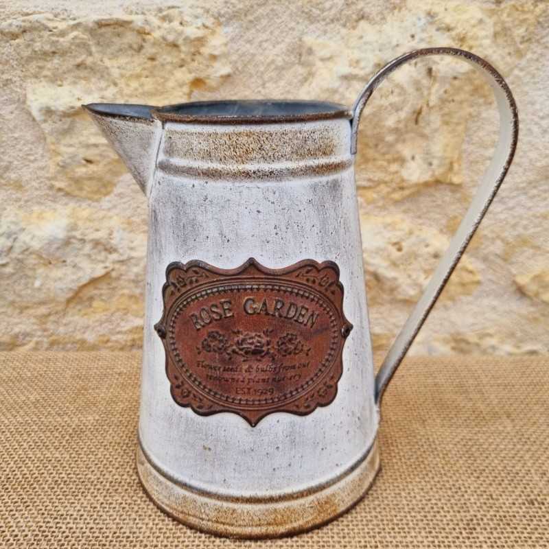 Decorative Vintage-Style Pitcher with Ornate Plaque Motifs