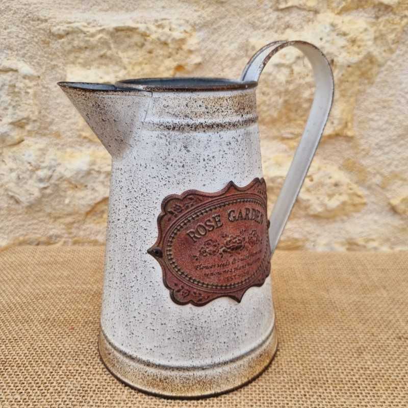 Decorative Vintage-Style Pitcher with Ornate Plaque Motifs