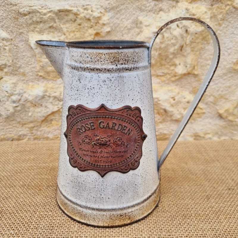 Decorative Vintage-Style Pitcher with Ornate Plaque Motifs