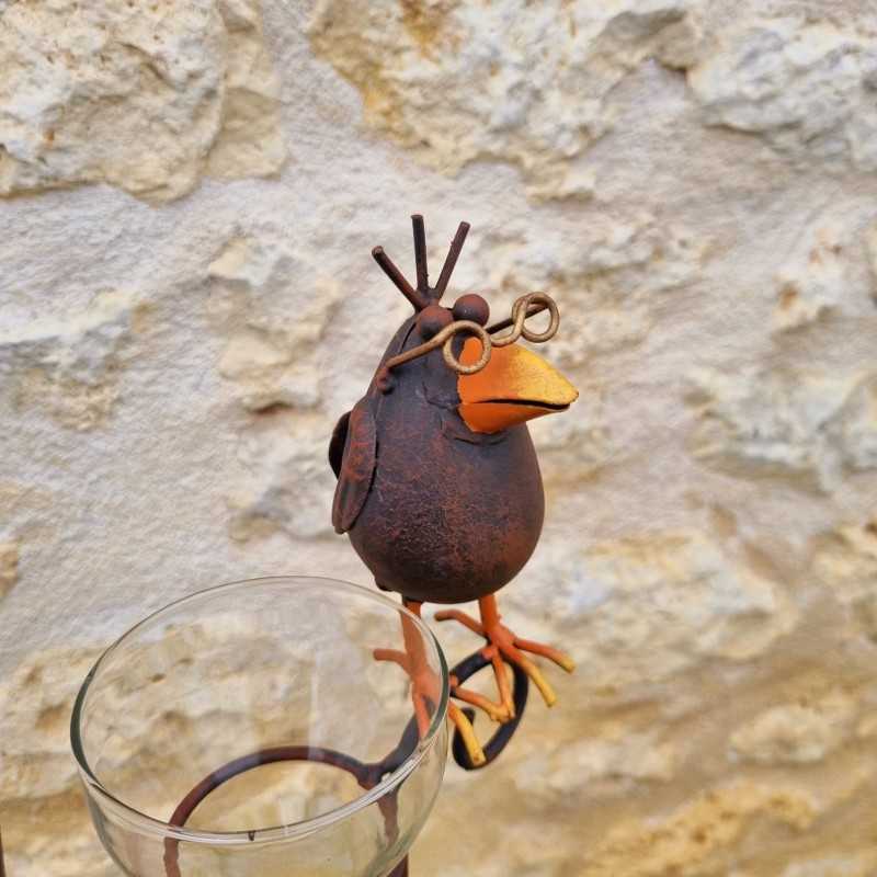Decorative rain gauge with a brown crow motif. -LDJ.