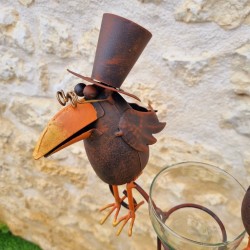 Decorative rain gauge with a brown crow motif. -LDJ.