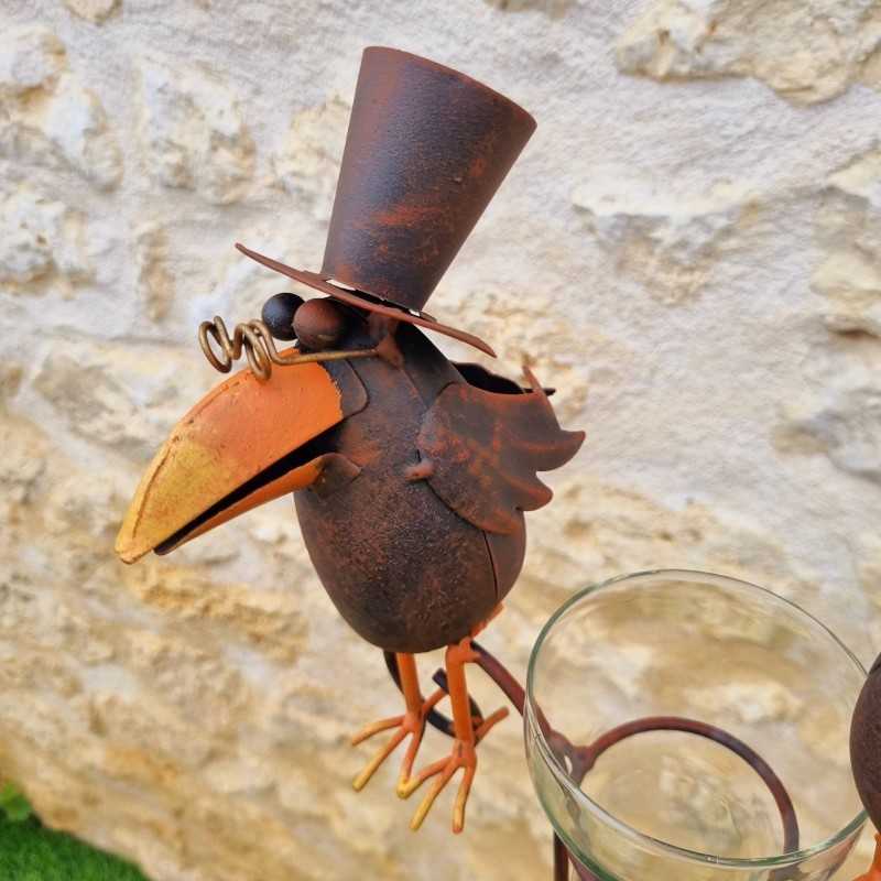 Decorative rain gauge with a brown crow motif. -LDJ.
