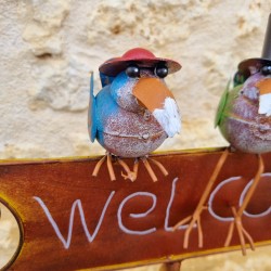 Stake, decorative garden support welcoming crows with colorful hats