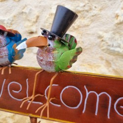 Stake, decorative garden support welcoming crows with colorful hats