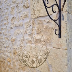Patinated beige and brown iron hanging plant basket
