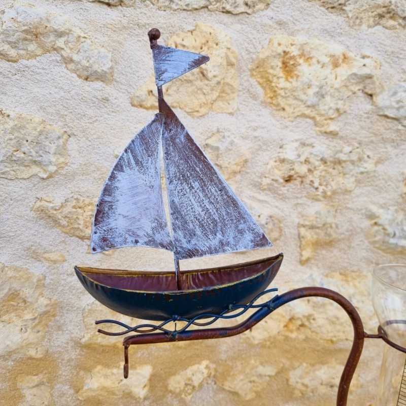 Decorative metal garden rain gauge with boat design, 134 cm high, close-up view of the boat