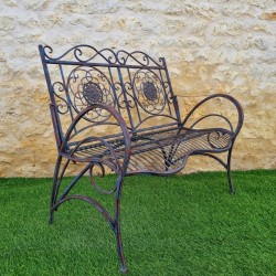 Wrought-iron garden bench with a patinated rust and antique blue finish