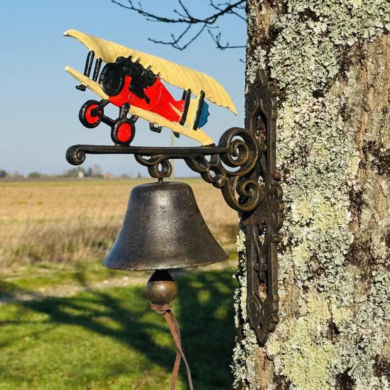 Cast iron wall bell with biplane side view