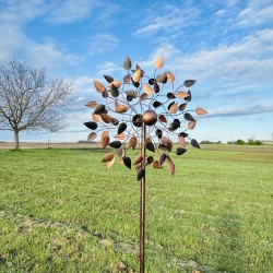 Amboise, decorative garden wind spinner in copper-toned metal in a garden