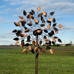 Detail of the copper-toned leaves on the Amboise decorative garden wind spinner turning with the breeze