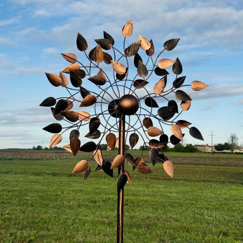 Detail of the copper-toned leaves on the Amboise decorative garden wind spinner turning with the breeze