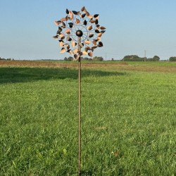 Full view of the Amboise decorative garden wind spinner, standing 212 cm tall, set in a charming countryside setting