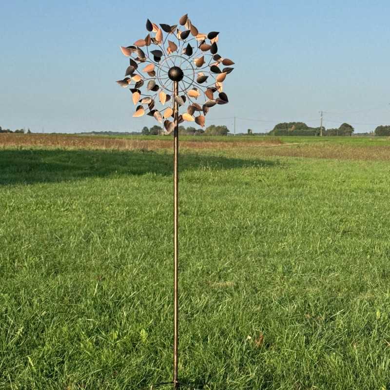 Full view of the Amboise decorative garden wind spinner, standing 212 cm tall, set in a charming countryside setting