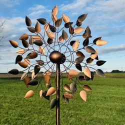 Amboise decorative garden wind spinner seen in full light, capturing warm coppery reflections