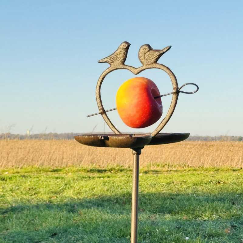 Detail of the small decorative birds on the metal bird feeder.