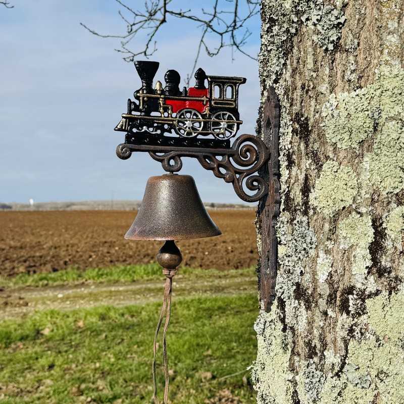 Cast-iron wall bell with locomotive – staged display